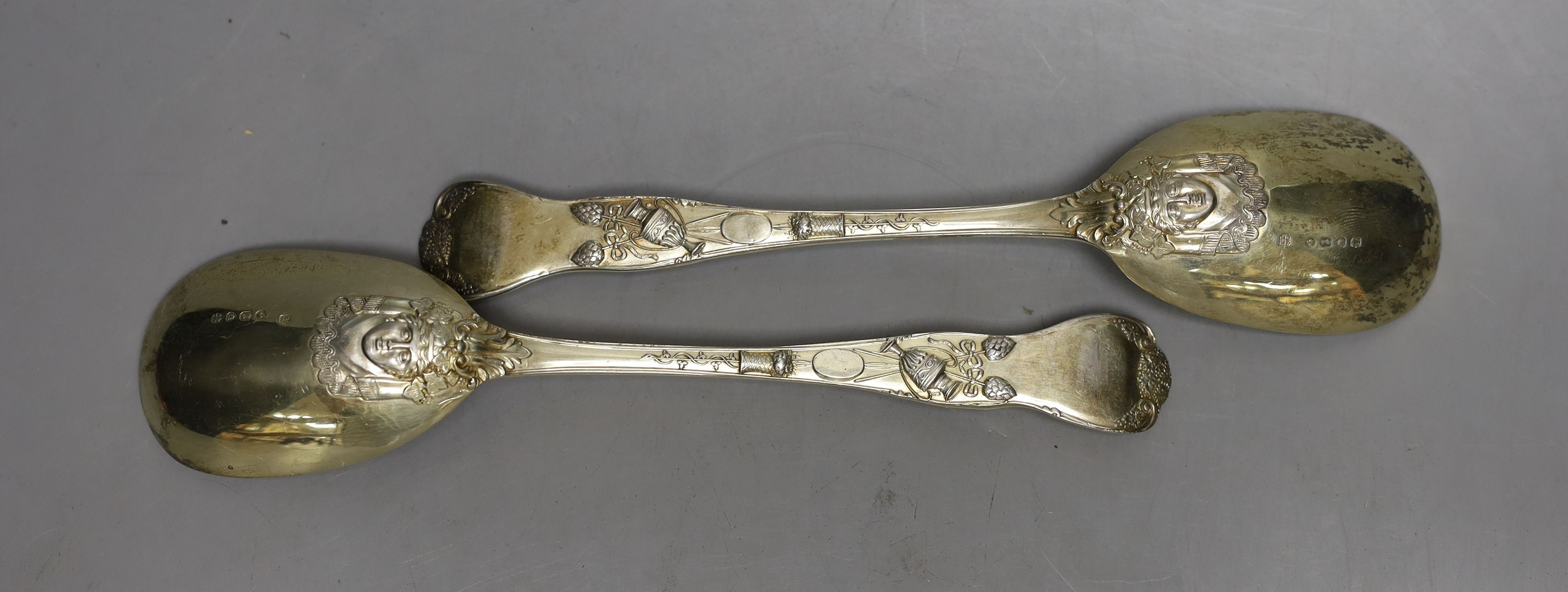 An ornate pair of Victorian silver gilt serving spoons, Lias & Lias, London,1874, 20.6cm, 6.4oz.